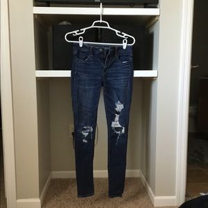 High waisted distressed jeans